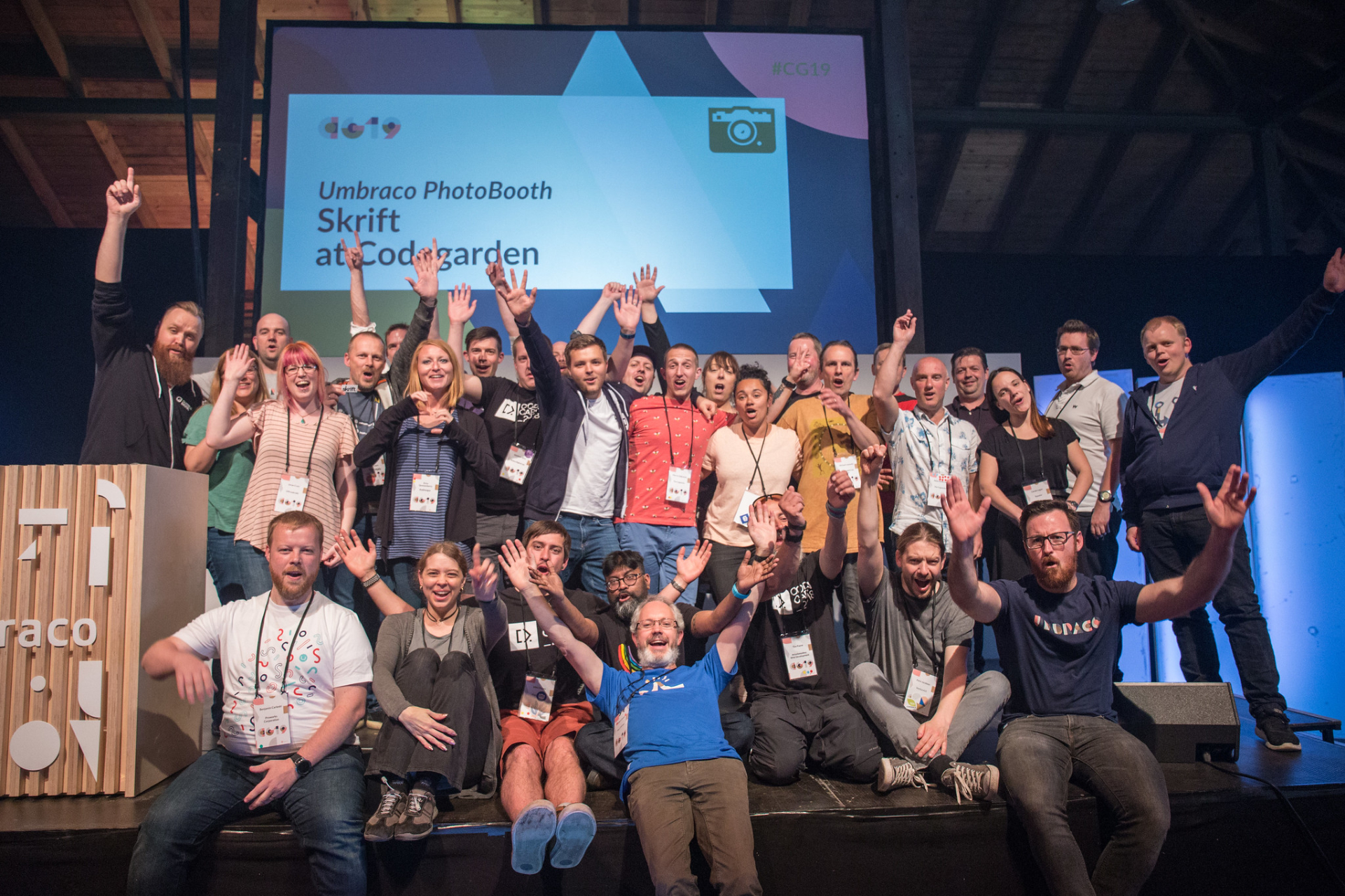 Authors who have written for the popular Umbraco magazine called skrift, all gathered on stage for a group photo.